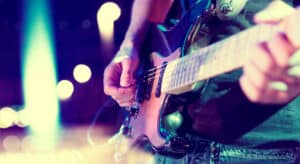 Close up of guitar and guitar player's hands during concert at Firekeepers Casino in Battle Creek MI.